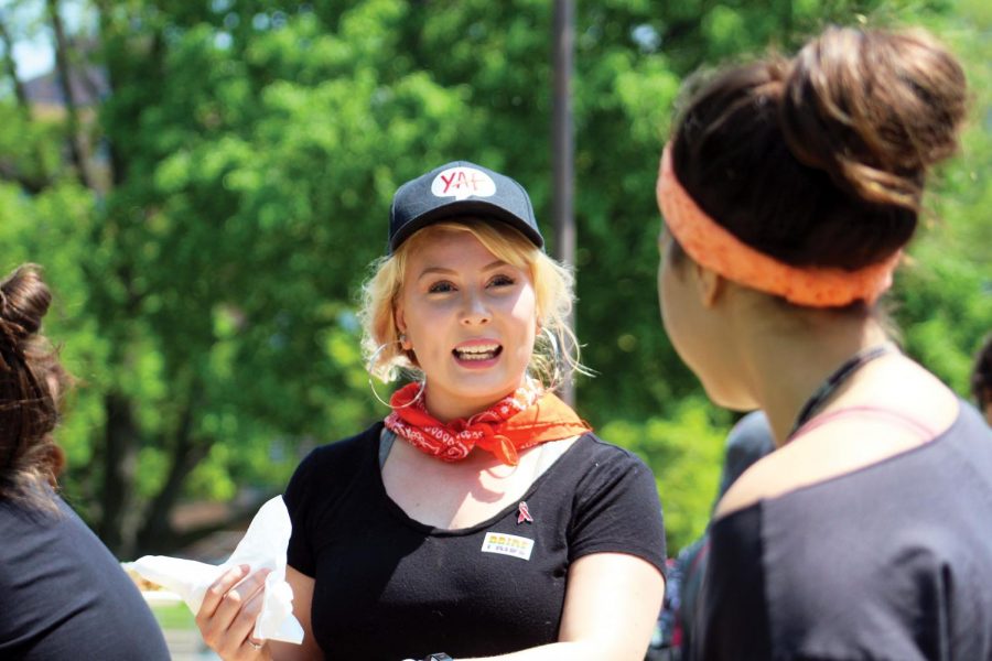 Show some pride: A Teen Pride volunteer serves free Chipotle to Pride attendees. The Teen Pride event was June 1 at Loring Park. The celebration
included many booths and activities, informing people about the LGBTQ+ community. Pride will be June 22-23 at Loring Park.