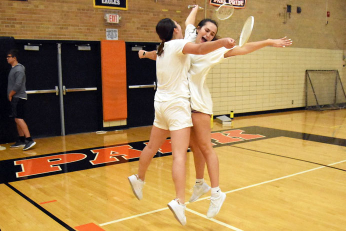 Juniors Lilly Strathman and Emma Amon celebrate during the badminton tournament Sept. 17. Strathman and Amon lost in the second round of the tournament.