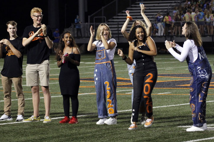 Homecoming court members cheer for senior Alyscia Thomas at the Homecoming football game. The Homecoming court was celebrated by Park football fans during halftime.