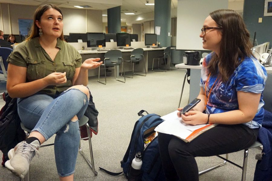Junior Liz Hodges practices while debate coach Samantha Leo times her. The debate team is currently preparing for an important upcoming tournament Nov. 8-9 at Apple Valley High School. 