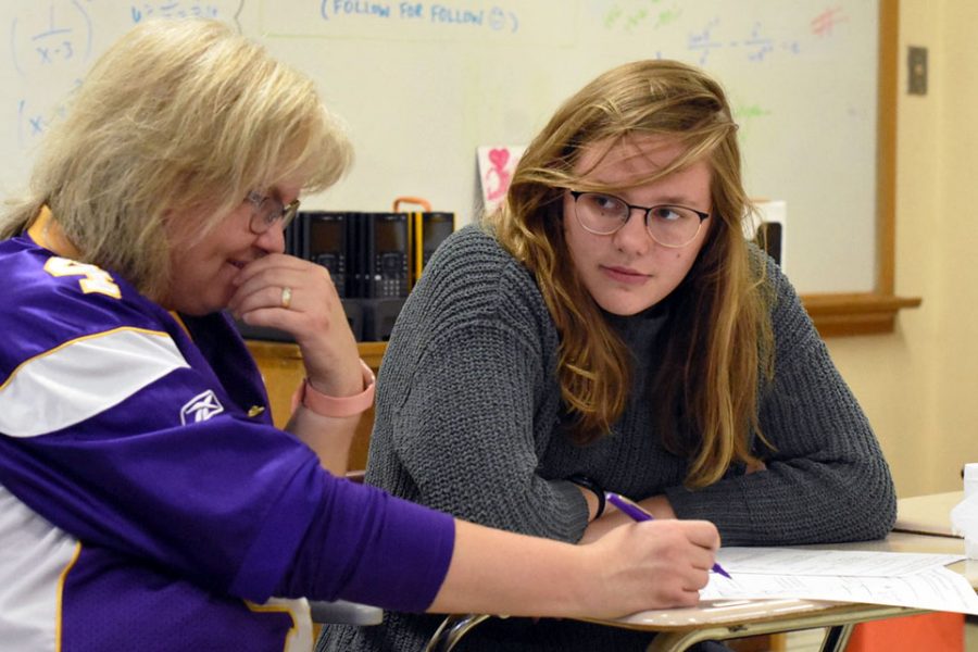 Math Team adviser Kari Johnson works with sophomore Sophie Davis during practice Oct. 21. According to Johnson, last season Park placed fourth in their conference. 