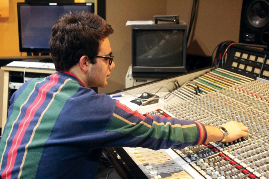 Senior Ethan Deetz works to produce music at his studio in Minneapolis. Deetz also teaches kids how to make music by a program funded by Prince.