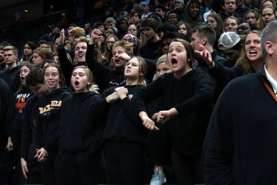 Seniors Ava Bishop, Sarah McCallon, Emma Roloff and Sydney Ring yell after the referee makes a call against Park. The dress code Nov. 7 was blackout. 