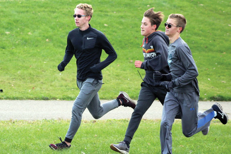 Junior Jackson Thoe, sophomore Henry Nelson and freshman Denly Lindeman prepare Oct. 30 at Louisiana Oaks for Nike Cross Regionals. Some of Park’s cross country runners will travel to Sioux Falls Nov. 9-10 to compete.