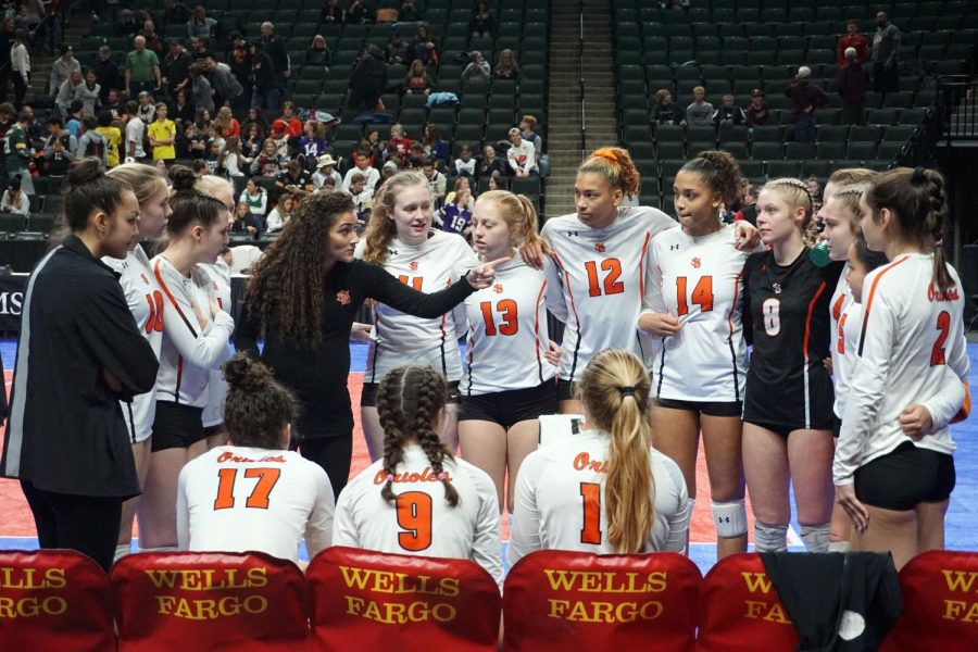Head coach Whitney Meierotto-Simon critiques her team on their performance during a time-out. Meierotto-Simon recently won section 6AA coach of the year.