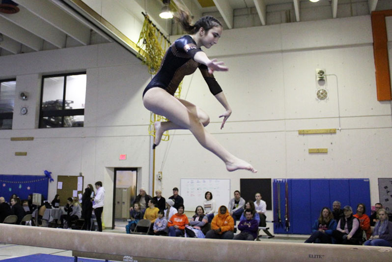 Junior Raina Kronfeld performs her beam routine Dec. 21 at North Star Elementary. Park placed first in the invitational meet that consisted of five other teams.