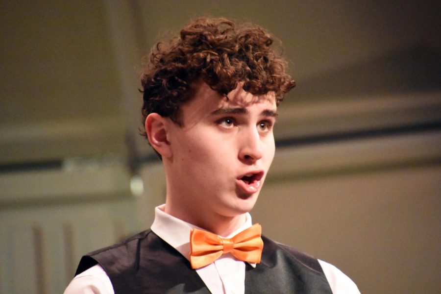Junior Leo Dworsky sings during the winter concert Dec. 17. According to Dworsky, the concert was a success. We worked so hard to prepare, we had so many rehearsals and then to see it all come together was truly amazing, Dworsky said. 