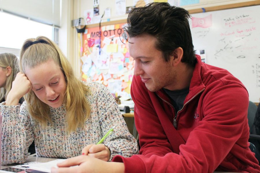 Senior Sam McGurgan works with math teacher Bobby Otto to complete a math assignment Dec. 13. Math tutoring encourages students to feel more confident in their work. 