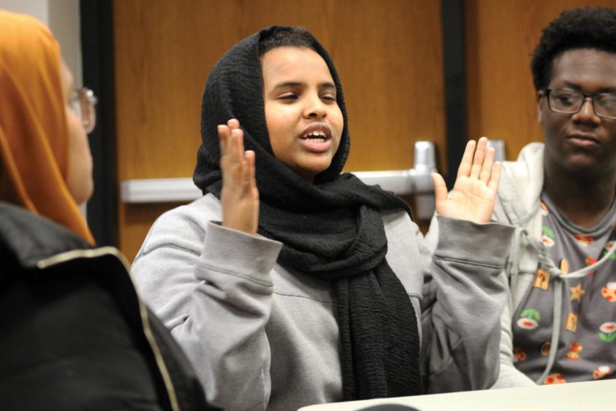 Junior Amal Abdi talks with fellow SOAR members Dec. 2, 2019. SOAR recently held a meeting with Mayor Jake Spano discussing racism in the community.