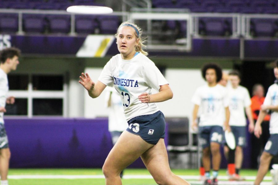 Senior Amelia Ryan reaches to catch the disc during the game against Edina Nov. 30. Marta Hill, Amelia Ryan, Lauren Schmelzler and Danny Shope played on the Minnesota All-Star team at U.S. Bank Stadium. 
