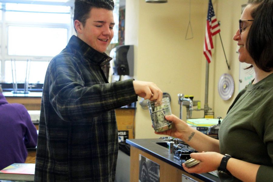 Junior Isaac Scott donates toward the wildfires in Australia Jan. 6. Science teacher Jessica Gust hopes to raise funds for resources in Australia. 