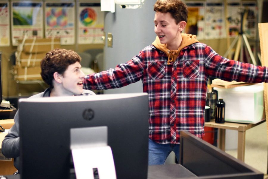 Freshman Isaac Cantor speaks with senior Ethan Meisler during the ACE meeting Jan. 30. ACE will present at the University of Minnesota March 5.