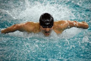 Sophomore Hiro Mckee swims the 100-yard butterfly during the Varsity Sections meet Feb 20. The second day of the meet will be Feb. 22 at the Art Downey Aquatic Center.