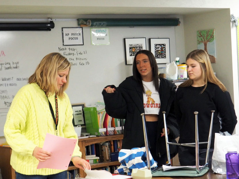 Seniors and Student Council co-presidents Anna Wert and Anna Nicholls discuss Sno Daze plans with adviser Sarah Lindenburg. Student Council is in charge of organizing Sno Daze week activities and decorating for the dance.