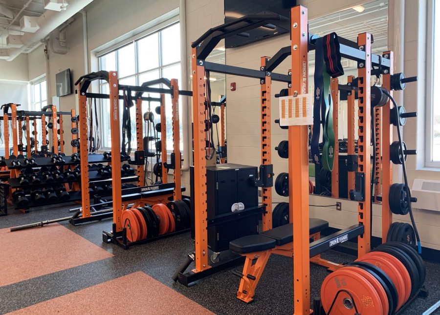 Bench+presses+in+the+new+weight+room+Feb.+27.+The+new+weight+room+will+improve+the+overall+fitness+of+students.+