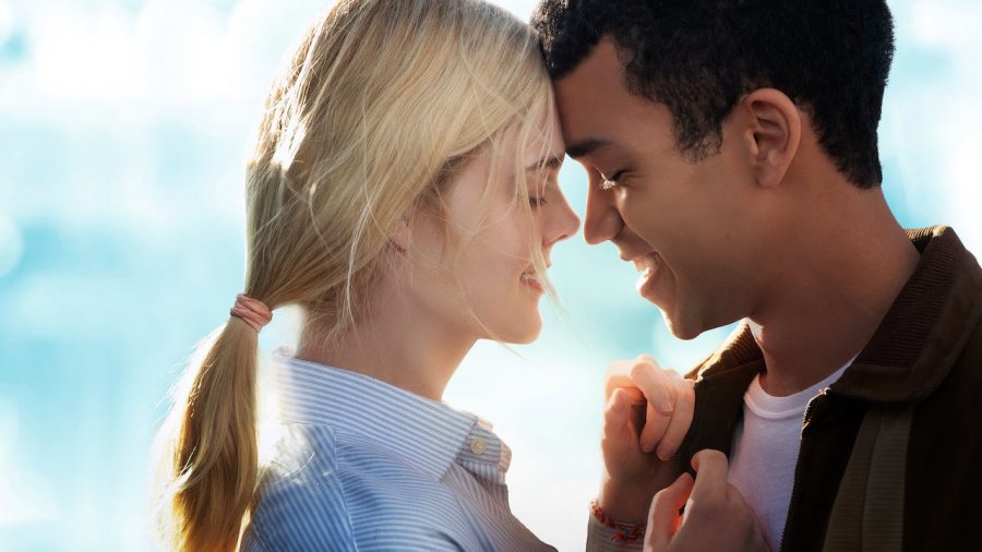 Fair use from Netflix. Violet Markey (Elle Fanning) and Theodore Finch (Justice Smith) embrace each other. All the Bright Places follows Violet and Finch in their journey to overcome past struggles and face new challenges while learning to love one another.