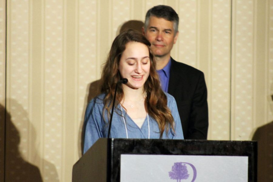 Junior Sophie Yakes speaks on behalf for the club Roots and Shoots during the Childrens First Champion Breakfast March 5 at Double Tree Park Place Hotel. Yakes said she wants to promote awareness to citizens of St. Louis Park on how to take action. 