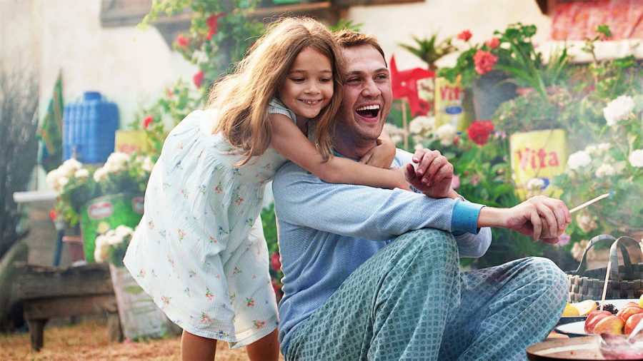 Fair use from Netflix. Daughter Ova (Nisa Sofiya Aksongur) hugs her dad Memo (Aras Bulut iynemli). Memo, with an intellectual disability, ends up being jailed for a crime he didn’t commit and must prove his innocence in order to be with his daughter.