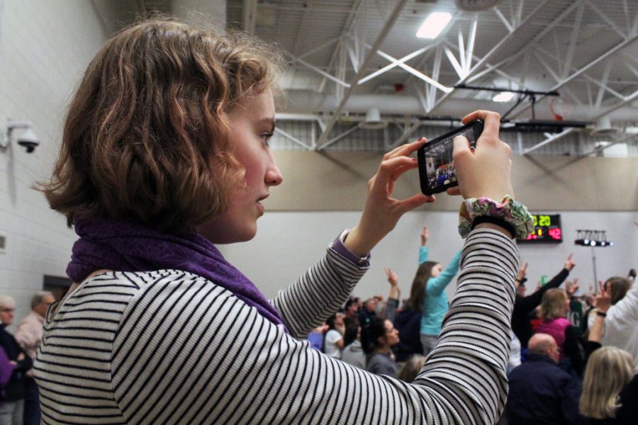 Senior and Editor-in-Chief of Echo Marta Hill films protestors at the presidential rally of Sen. Amy Klobuchar March 1 at Park. Hill was named a runner-up in JEAs 2020 National High School Journalist of the Year competition April 18. 
