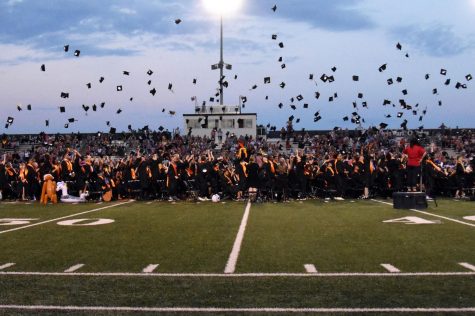 The class of 2019 throws its caps in the air after graduation June 6. The graduation for the class of 2022 will take place at 7 pm June 7 at the stadium.