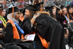 Park alum Natalia Caraballo gives her classmate a hug during Graduation June 6, 2019. After Gov. Tim Walz banned all large in-person commencement ceremonies for the class of 2020 in light of the COVID-19 pandemic May 8, Park had to reevaluate its Graduation plan.