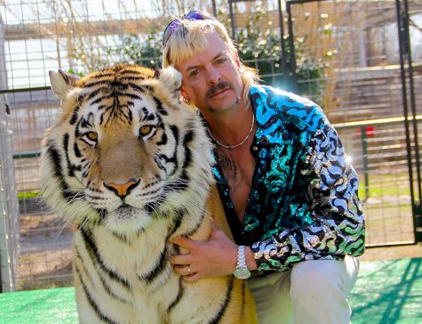 Joseph Maldonado-Passage, also known as Joe Exotic, poses with one of many tigers he owned. Maldonado-Passage is the main subject of the Netflix series Tiger King.
