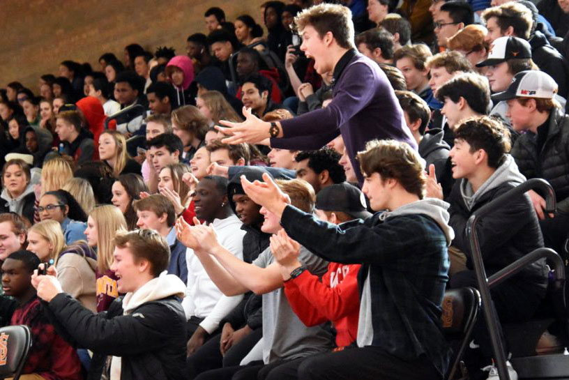 The senior section cheers during the Pep fest Feb. 14. The teachers took the victory in the teacher vs. student basketball game with a score of 29-24.