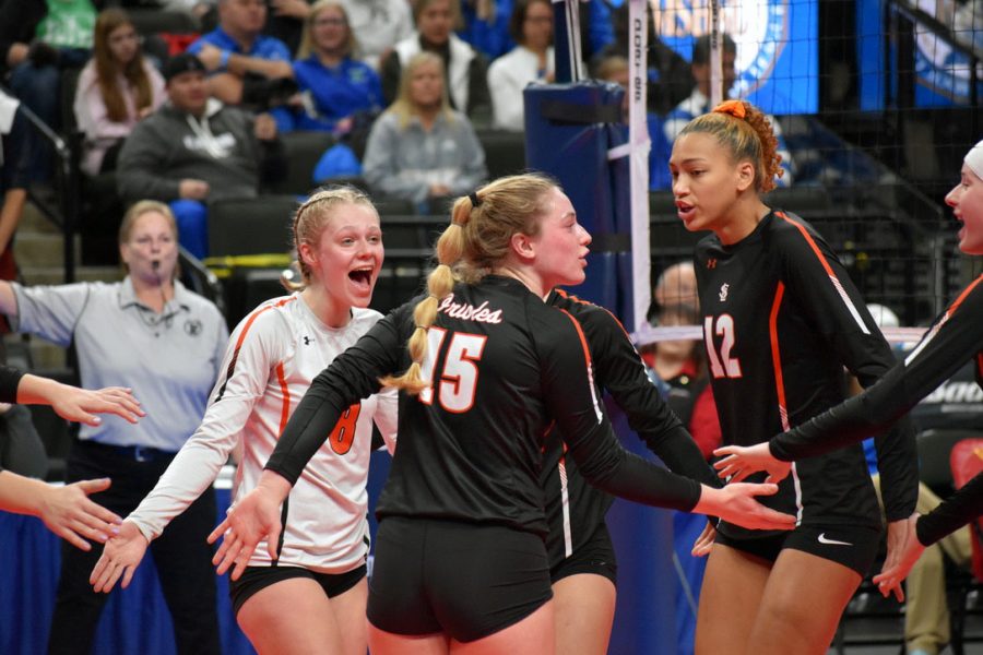 Park alumni Addie Warg and senior Kendall Coley celebrate after a point at the Minnesota state volleyball tournament Nov. 7, 2019. The Minnesota State High School League voted to reinstate the fall seasons of volleyball and football Sept. 21. 
