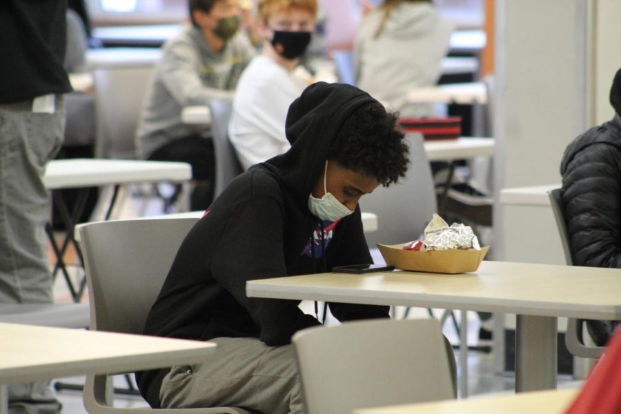 Students eat their lunches at socially distant tables Oct. 26. Due to the budget overage, many nutrition staff providing these lunches will be voluntarily furloughed.