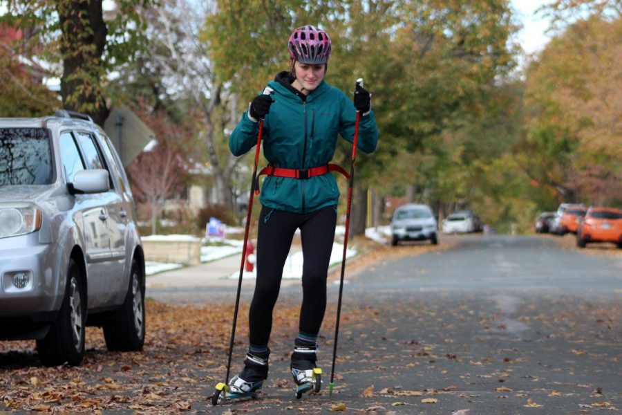 Senior co-captain Olivia Etz roller skis down a neighborhood road Oct. 26. Olivia is a three-season athlete competing in cross country, nordic and track. 
