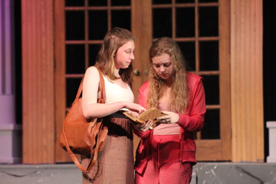 Seniors Annica Schultz and Phoebe McKinney rehearse their lines for the fall musical last year, “Legally Blonde.” This year’s production of “Vintage Hitchcock: A Live Radio Play” will be available to stream around the end of November. 