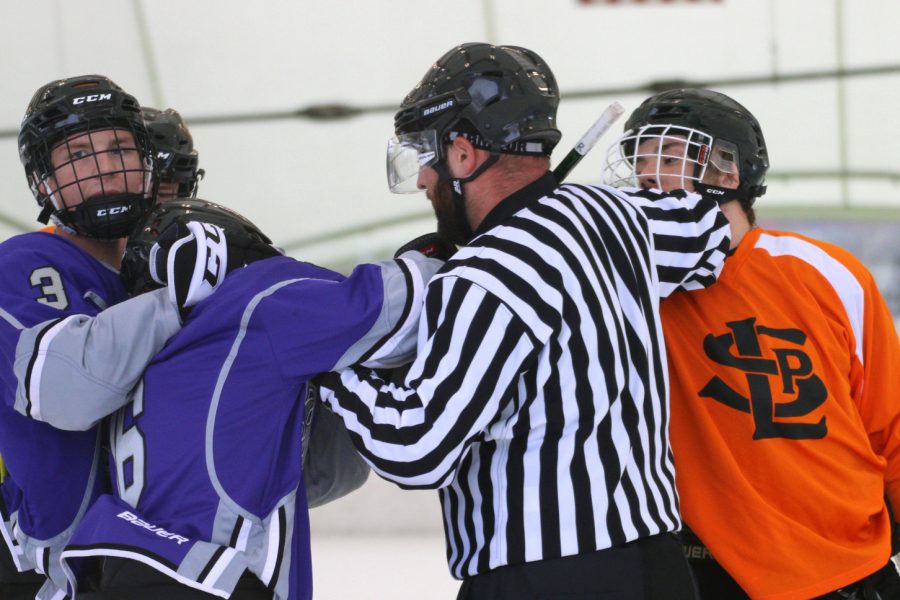 Senior Drew Boyum gets into an argument with an opposing player while the referee breaks them up Oct. 31. Park won against Buffalo 5-3.