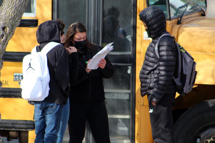 Students figure out which bus to take home after the first day of hybrid learning Oct. 26. When hybrid learning returns Feb. 22, teachers will once again be tasked with balancing distance and in-person cohorts.