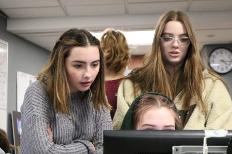 Seniors Maddie Schutte and Sophie Livingston work on a page during Echo late night Feb. 3, 2020. Echo was one of 21 schools that received a National Newspaper Pacemaker award.