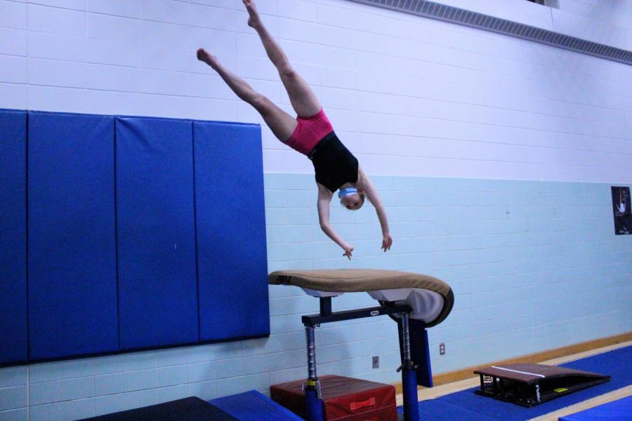 Senior+Maddie+Olsen+practicing+the+vault+jump+Jan.+15.+The+gymnastics+team+lost+to+Hopkins.+