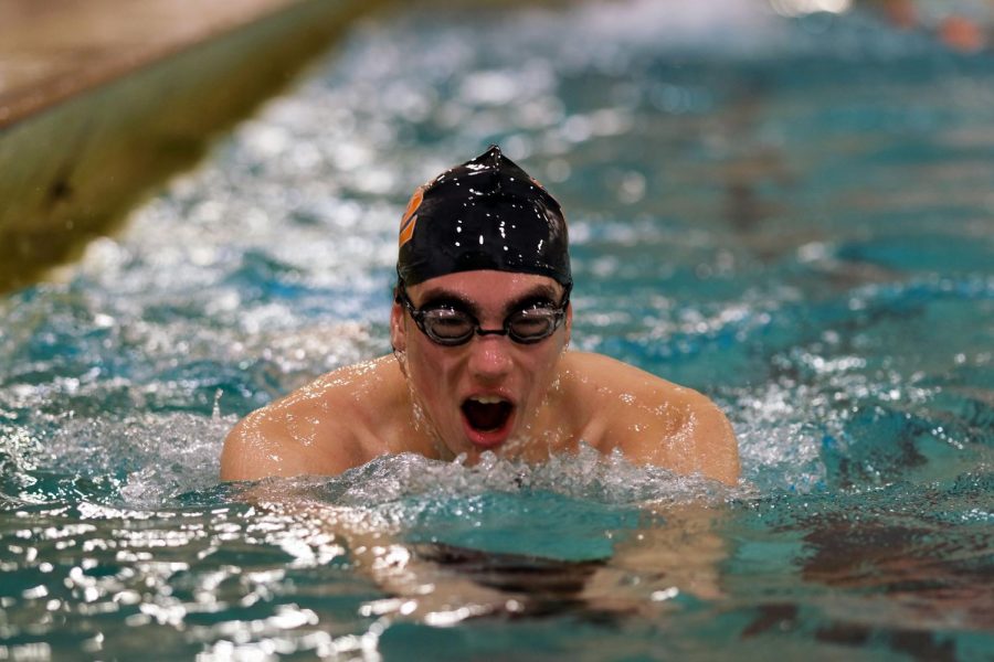 Junior Asher Danicic practices his breast stroke Jan. 20. The boys’ swim team has won both of its meets this season.
