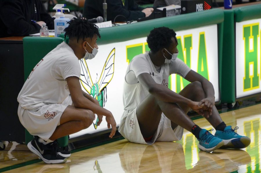 Seniors Paris Johnson and Tyshawn Lyons sit on the sideline ready to check in to the game Jan. 14. Park lost to Edina 68-86 in the first game of their season.