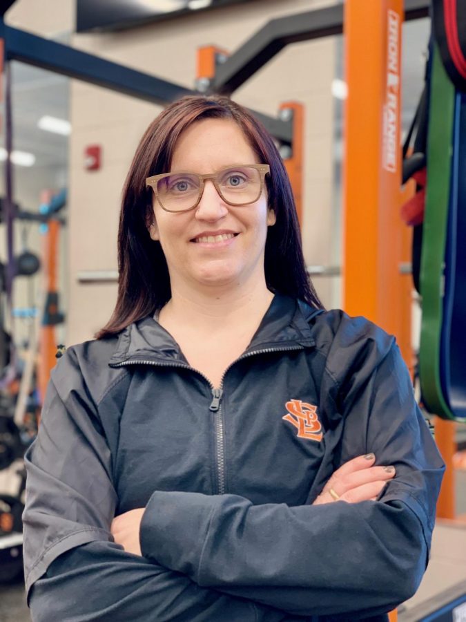 Used with permission from Jessica Gust. Science teacher and strength and conditioning head coach Jessica Gust poses in the weight room Feb. 22. Gust was nominated to serve on the advisory board for the National High School Strength Coaches Association.