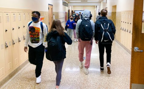 Students walk through the A3 hallway as they head to their next class Feb. 22. The return of hybrid learning has brought mixed emotions among students.