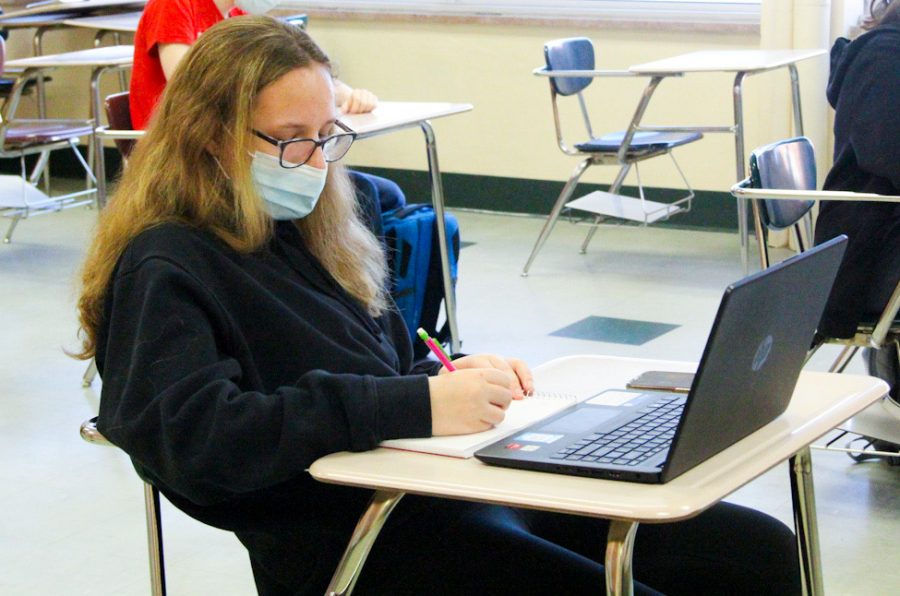 Freshman Evie Schmitz works on an assignment during her synchronous, first period French class Feb. 25. Park will combine Cohorts A and B to attend school in-person four days a week beginning April 12.