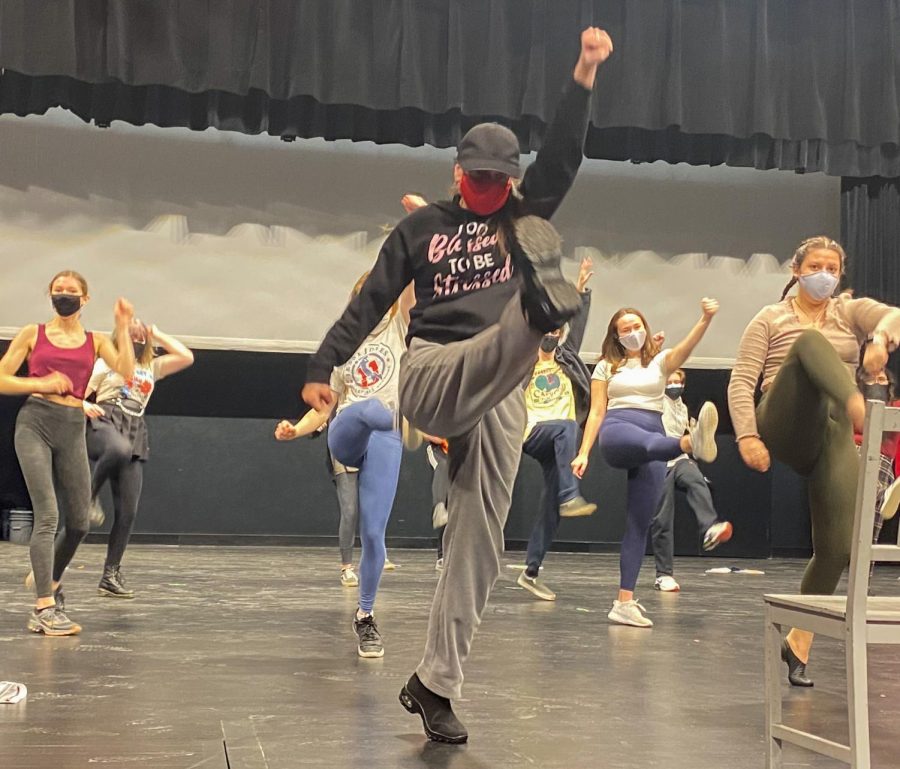 Choreographer Julianne Mundale teaches the opening number to the cast. The spring musical working features interviews from different working Americans. 