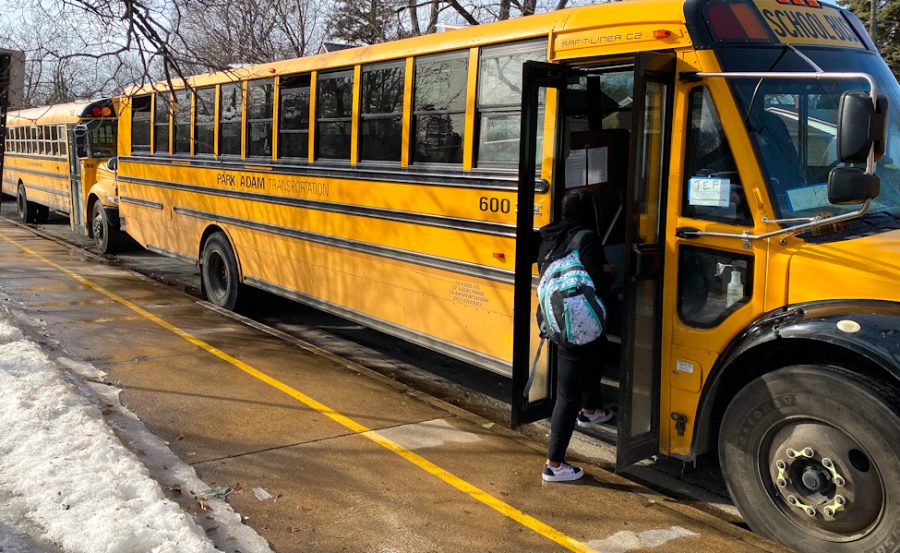 Students getting on buses after school March 8. COVID-19 has created a different atmosphere where bus drivers and students must focus on adapting to the situation.