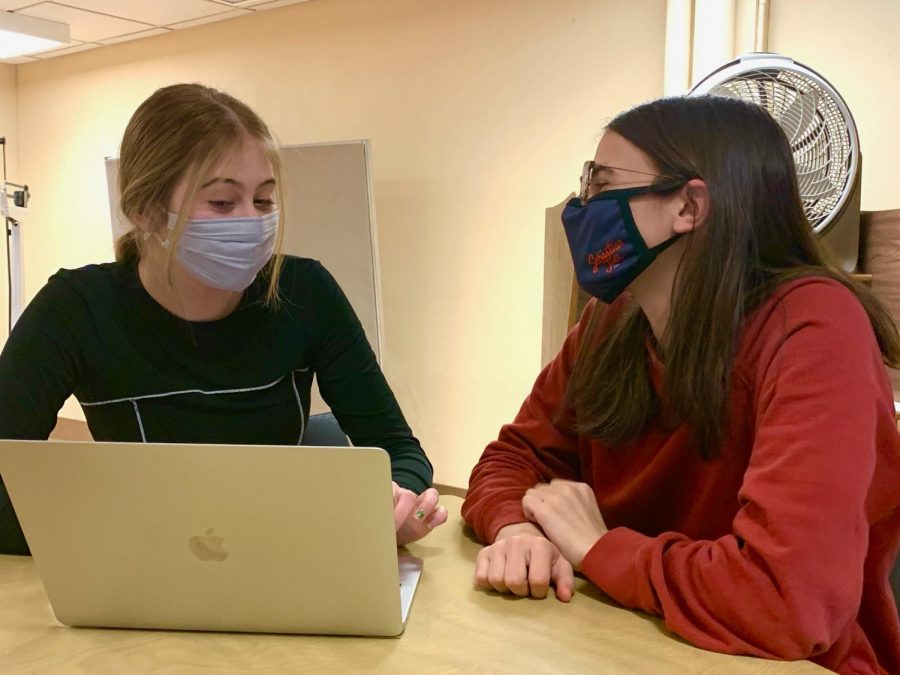 Sophomores Fiona Shaack and Fiona Long working together March 19. Along with their group, they advocated for feminine hygiene dispensers to be put in at Park.