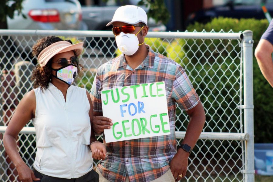 Protesters+hold+up+a+justice+for+George+sign+at+a+protest+June+4.+Former+police+officer+Derek+Chauvin+is+being+charged+for+the+murder+of+St.+Louis+Park+resident+George+Floyd.