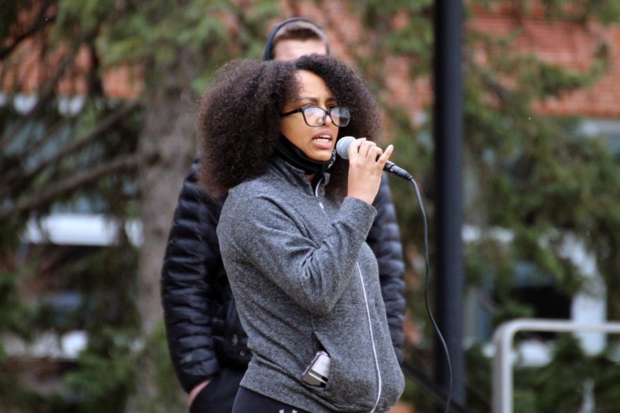 Junior Kim Parkinson speaks to crowd of students April 19. The walkout was organized by Students Organized Against Racism. 