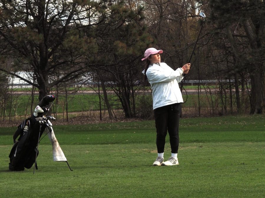 Sophomore Izzy Segal watches her ball after she hits it May 2 at Theodore Wirth Golf Course. Segal will participate in the State tournament starting June 15.