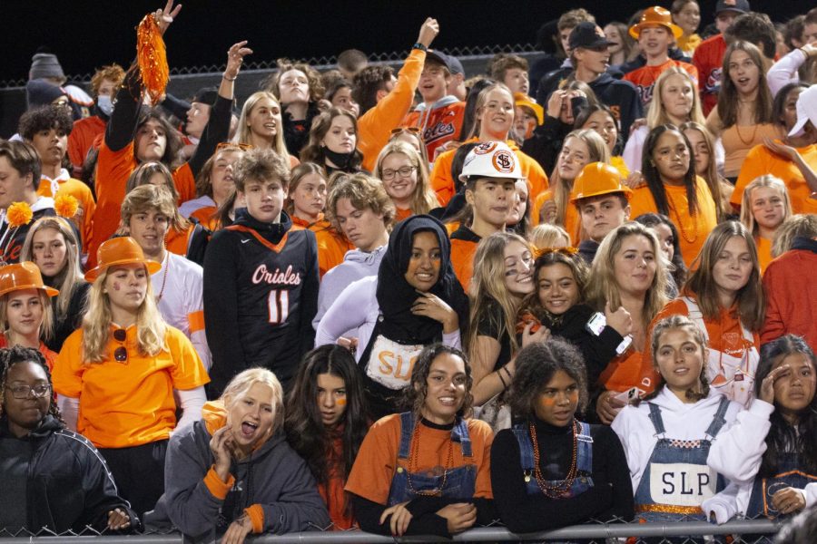 Students cheer on the football team at the homecoming game Sept. 25. During the pandemic, the absence of fans was missed by athletes.