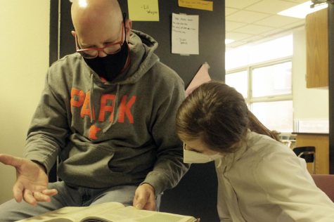 Club adviser Dan Ruzek and student Hera Roush discuss game strategies during a Dungeons and Dragons meeting Oct. 11. Dungeons and Dragons meets in A305 after school Mondays and Wednesdays. 