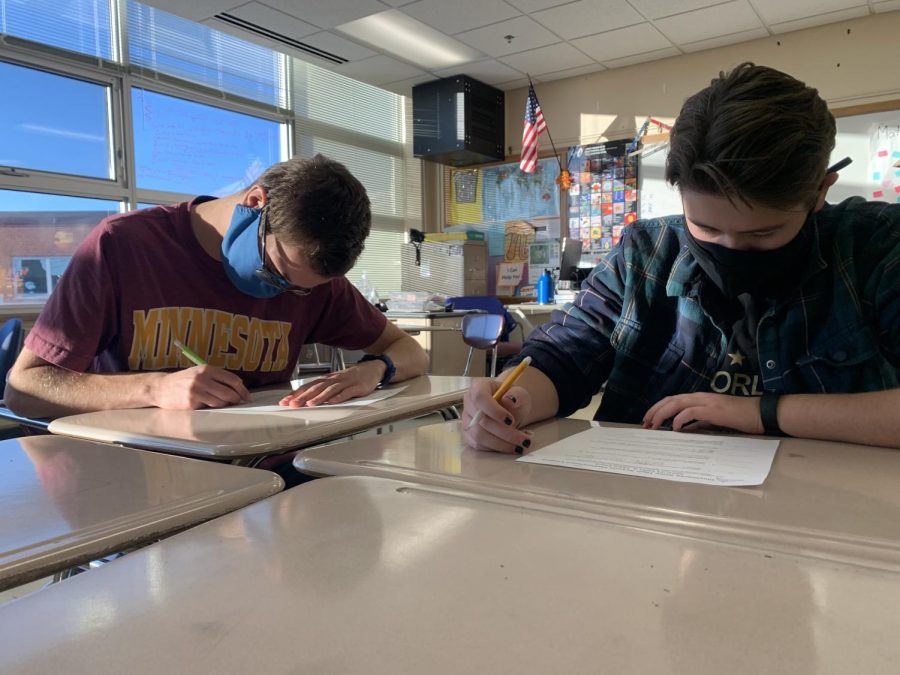 Junior Denly Lindeman and freshman Julia Lorenzen work on a set of practice problems Dec. 6. The team meets once a week on Mondays to prepare for competitions.