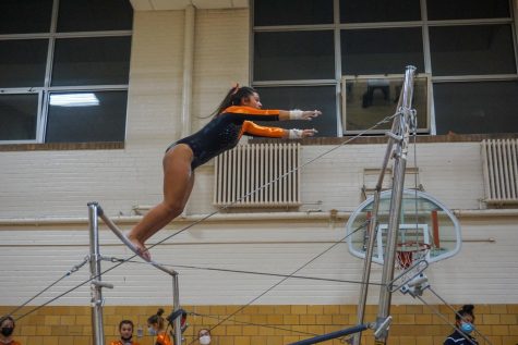 Senior Gabby Diaz performs her routine during a meet against St. Anthony Dec. 14. Despite losing the meet, the new members of the team have shown a lot of progress throughout the season thus far.